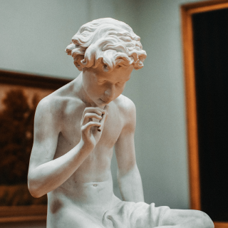 A marble statue of a boy